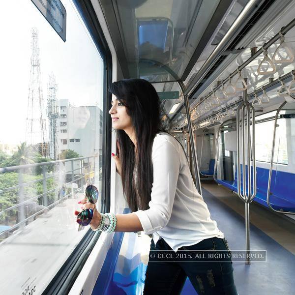 Trisha looking out the City View from Chennai Metro Train