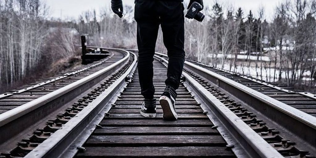 Man-Walking-on-Railway Track